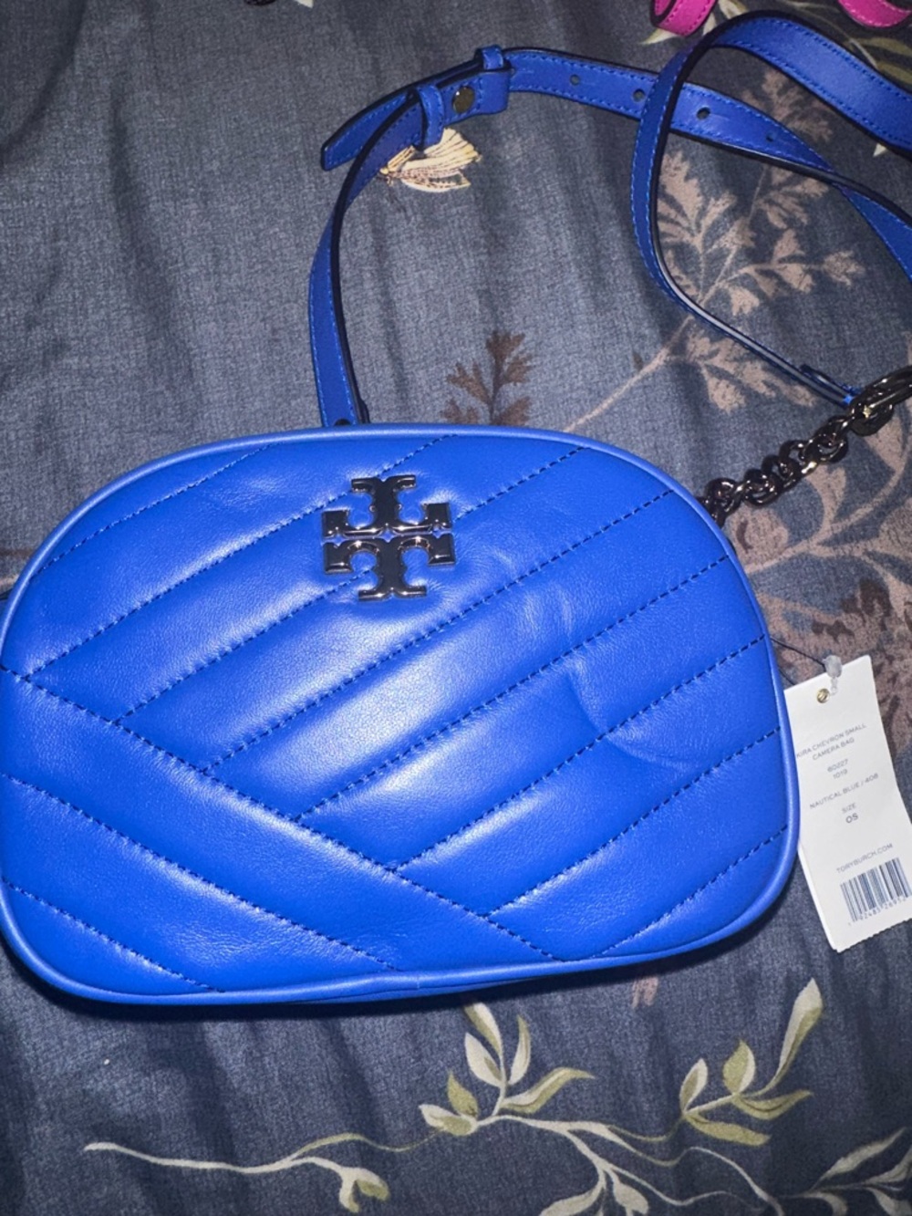 Tory Burch Royal Blue Quilted Crossbody Bag deep dent infront of bag
